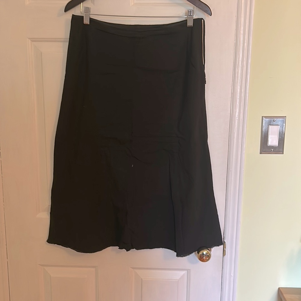 Black asymmetrical skirt with zipper at side and a tie